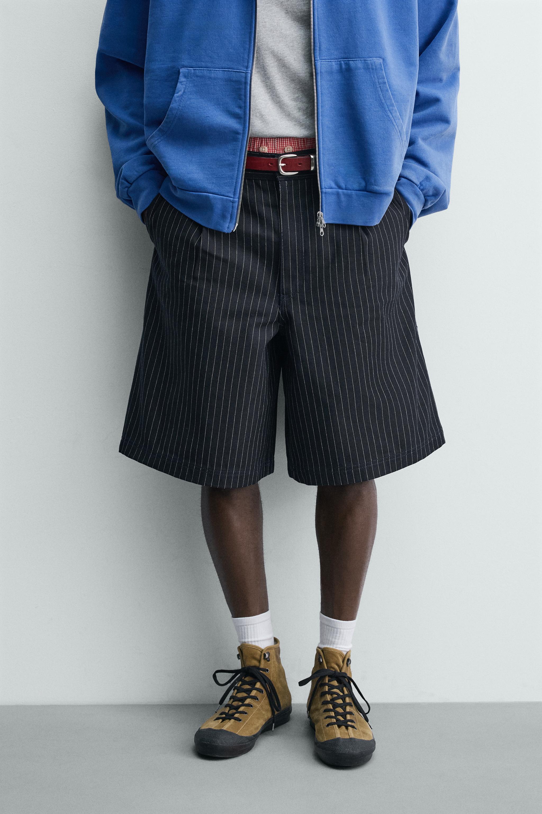 PINSTRIPED PLEATED SHORTS